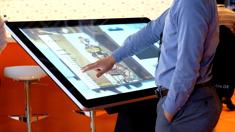 Large touchscreen kiosk in a shop displaying their latest catalogue
